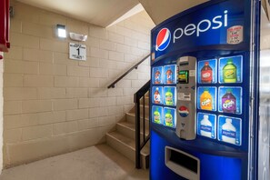 A stairwell with a Pepsi vending machine and a 'No Roof Access' sign. - Red Roof Inn Charlottesville (Charlottesville)