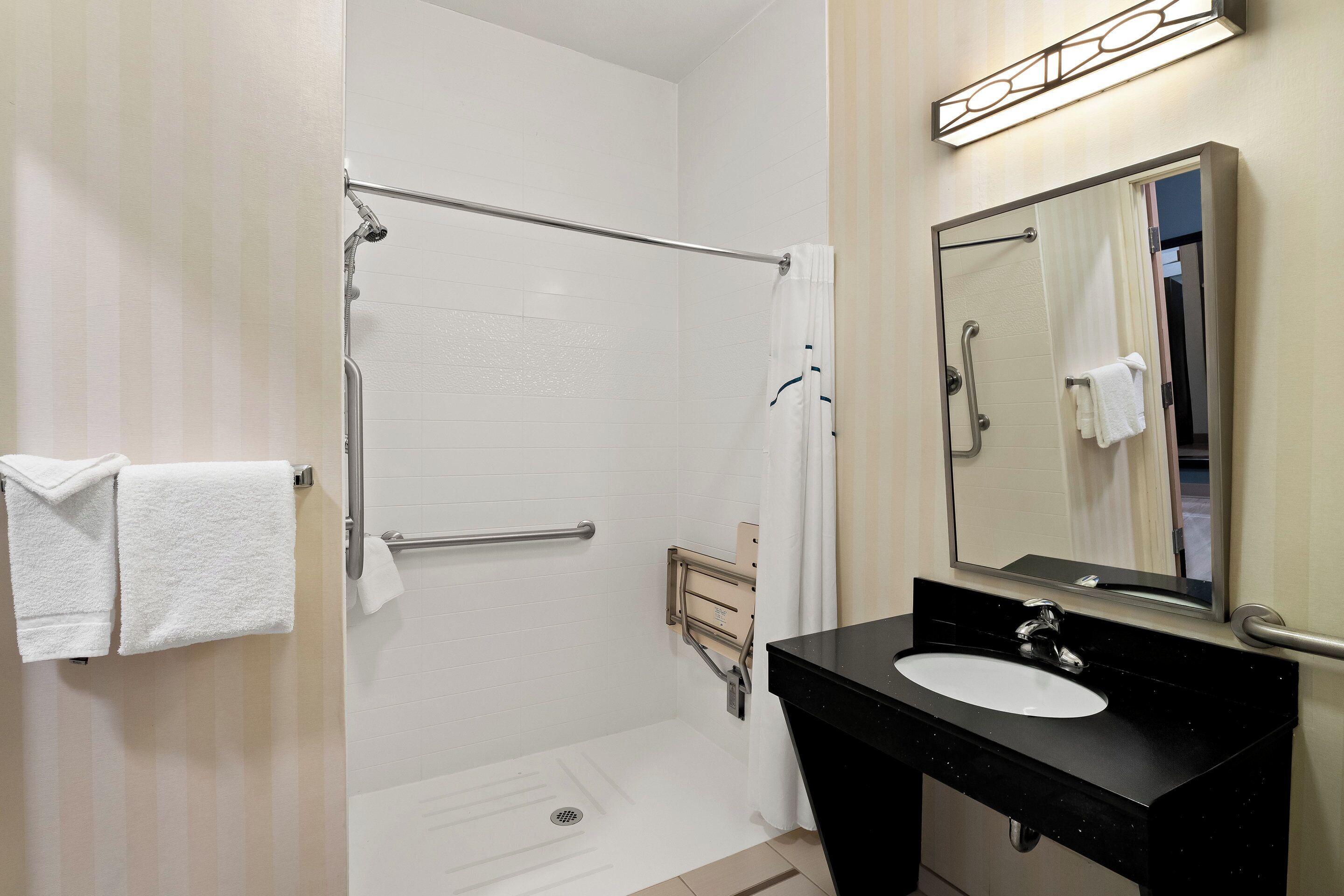 studio, 1 queen bed, accessible, non smoking (roll-in shower) | bathroom | combined shower/bathtub, free toiletries, hair dryer, towels