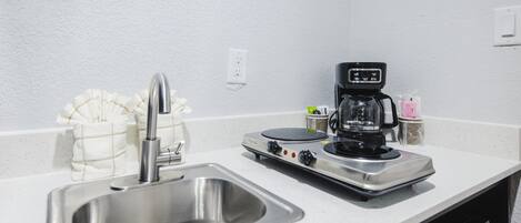 Full-size fridge, microwave, stovetop, coffee/tea maker