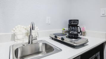 Full-size fridge, microwave, stovetop, coffee/tea maker