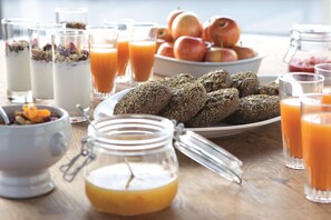 A breakfast setting with various food items and drinks. - Radisson Blu Scandinavia Hotel, Aarhus (Aarhus)