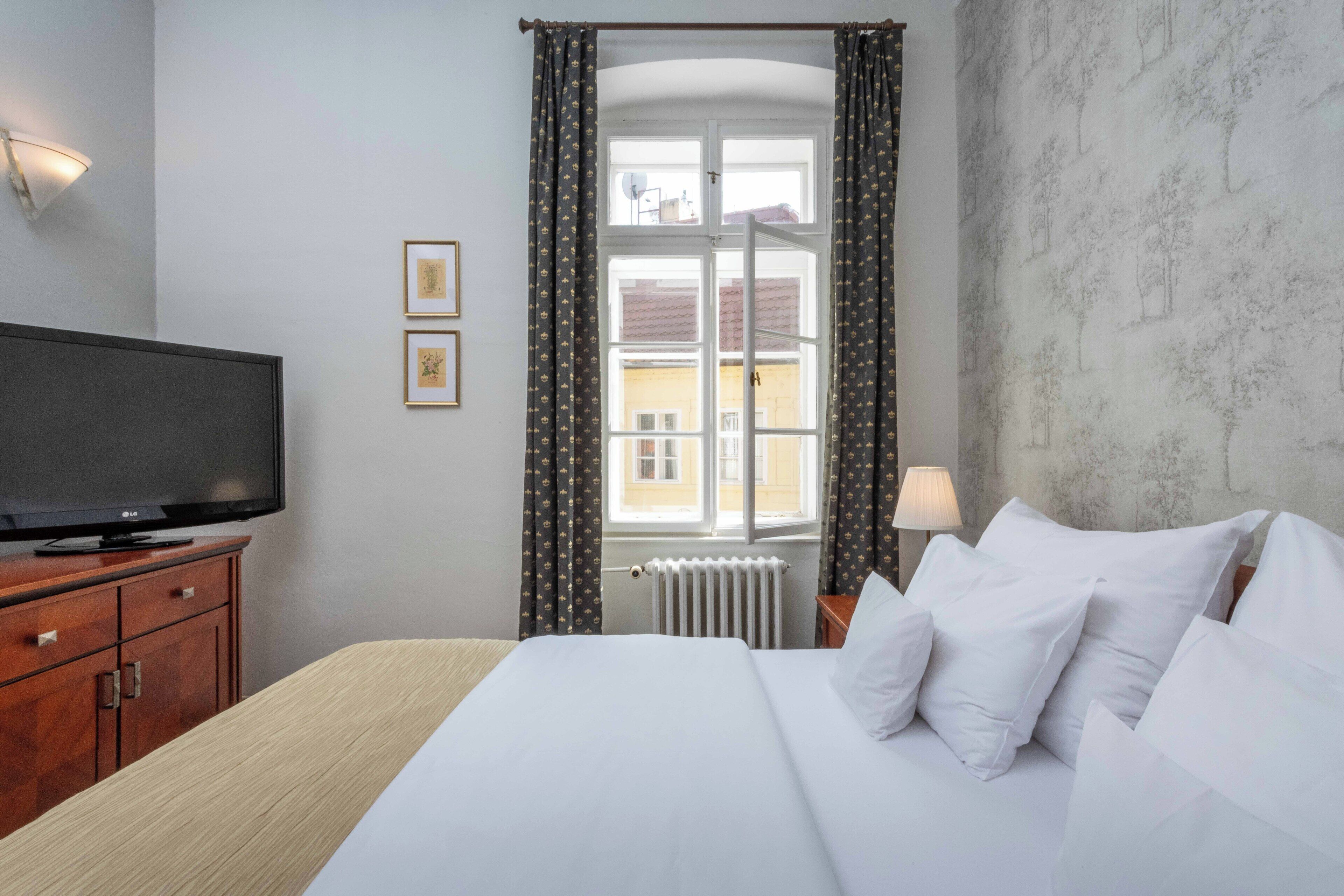 Suite – junior | Sengetøy av topp kvalitet, minibar og safe på rommet