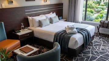 Premium bedding, pillow-top beds, desk, laptop workspace