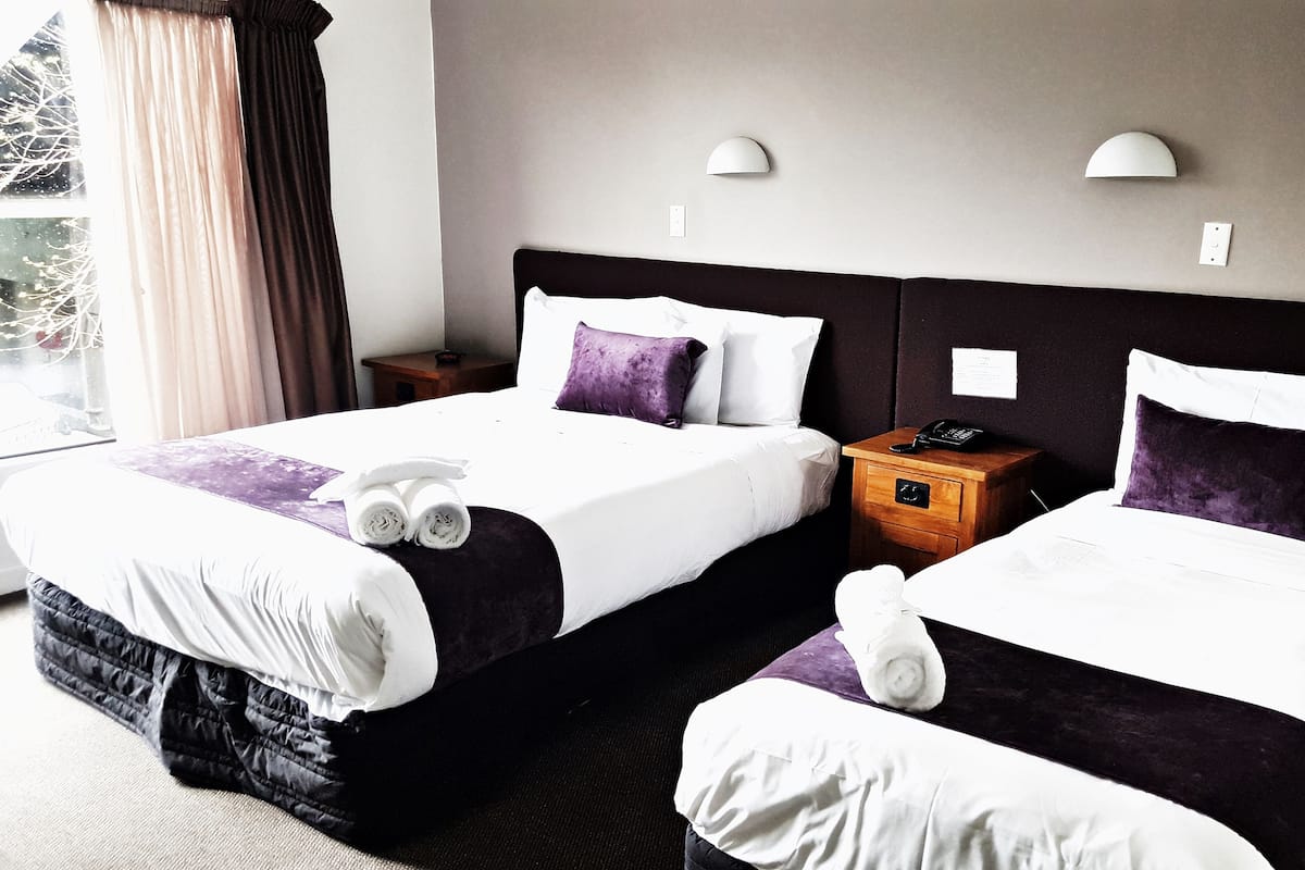 Premium bedding, pillow-top beds, desk, laptop workspace