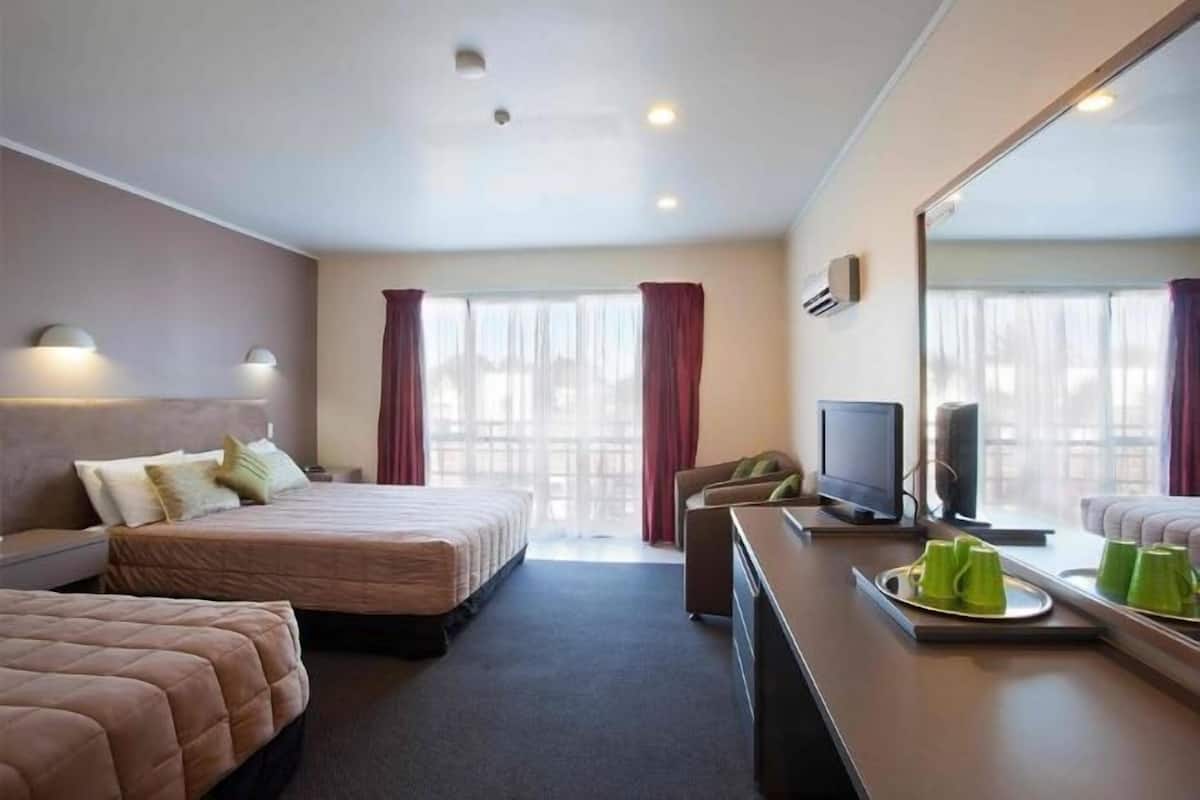 Premium bedding, pillow-top beds, desk, laptop workspace