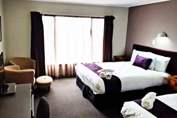 Premium bedding, pillow-top beds, desk, laptop workspace