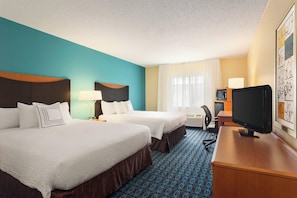Premium bedding, pillow-top beds, desk, laptop workspace