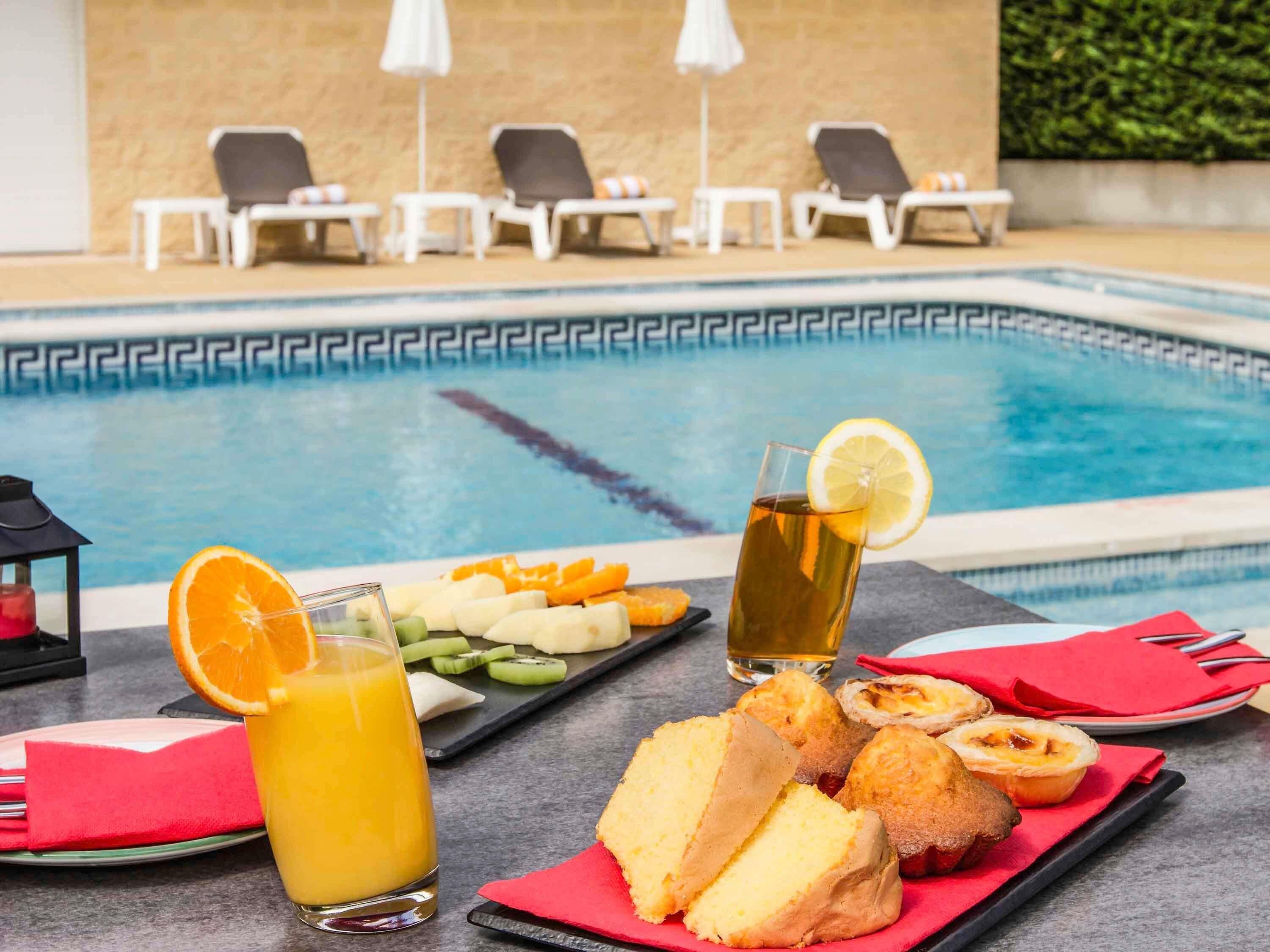 Seasonal outdoor pool, pool umbrellas, pool loungers