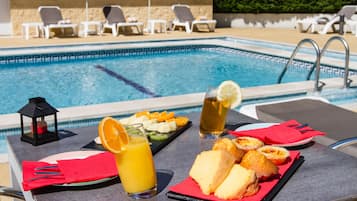 Seasonal outdoor pool, pool umbrellas, pool loungers