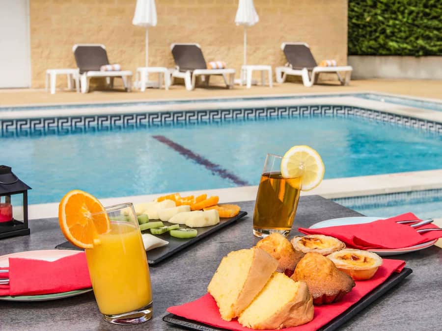 Seasonal outdoor pool, pool umbrellas, pool loungers