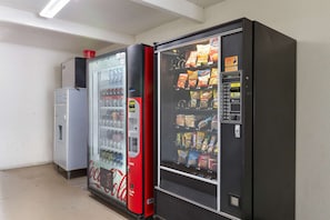 A vending machine with a Coca-Cola logo and a push-button interface. - Motel 6 Claremont, CA (Claremont)