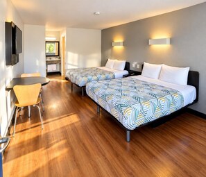 A hotel room with two beds, a desk, and a chair. - Motel 6 Claremont, CA (Claremont)