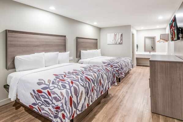 Desk, laptop workspace, blackout drapes, free cribs/infant beds