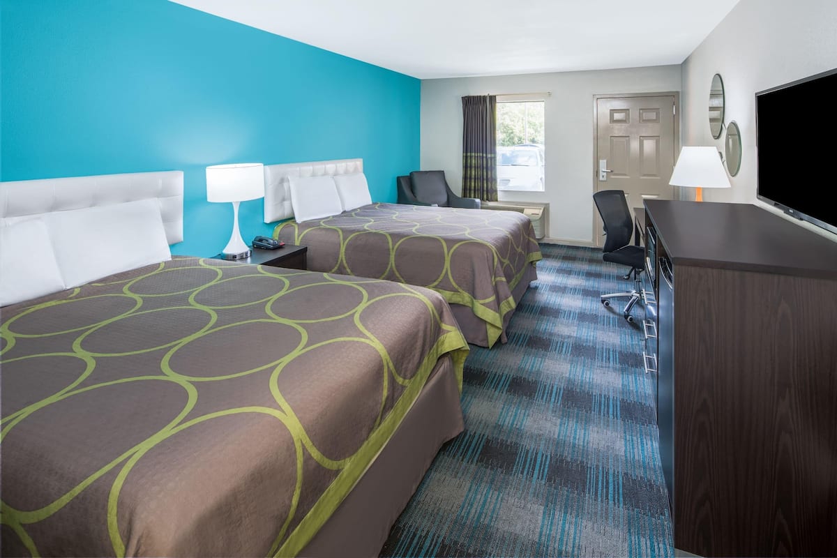 Room, 2 Queen Beds, Non Smoking | Individually decorated, individually furnished, desk, blackout drapes