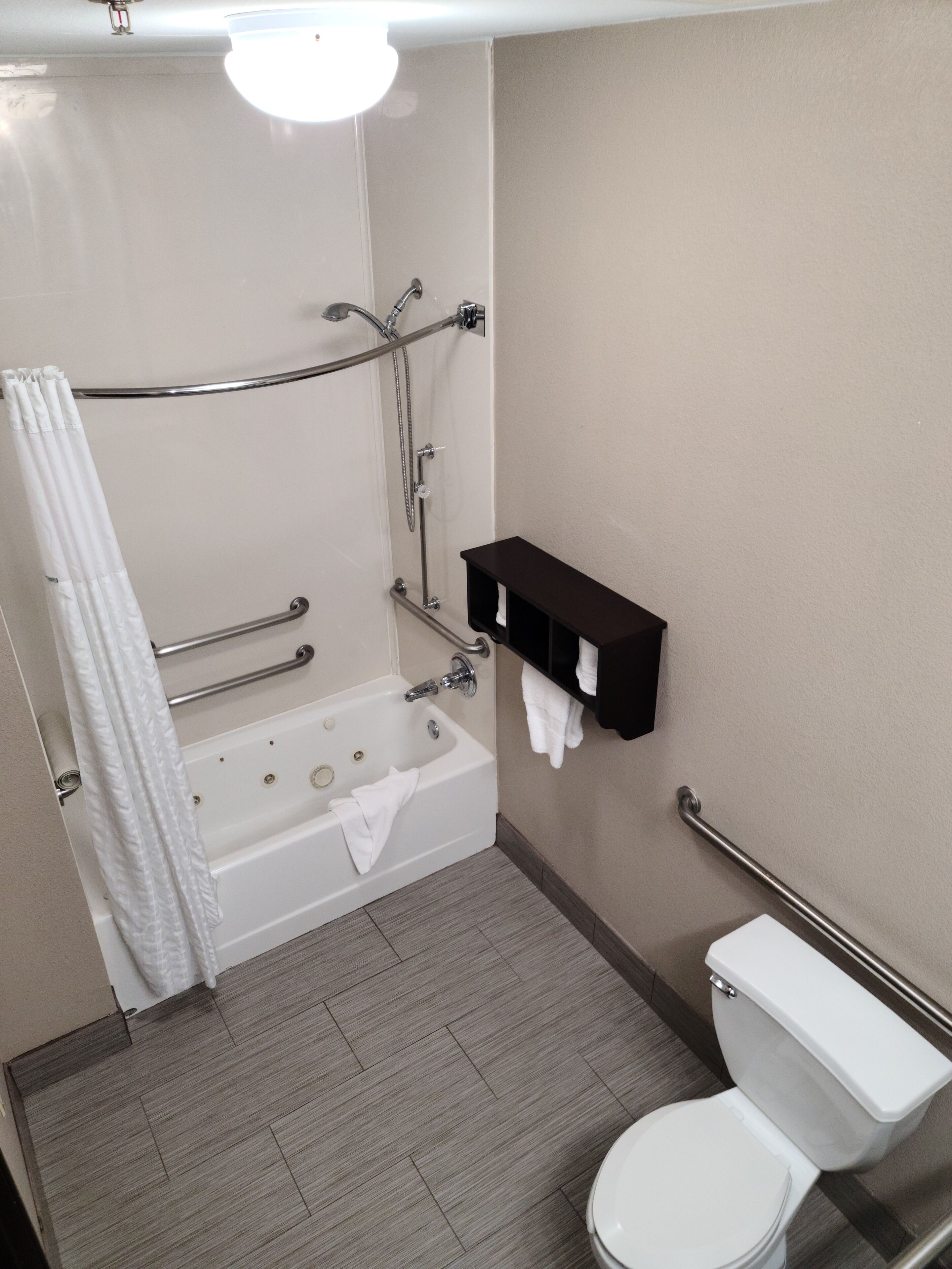 room, 1 king bed, accessible, refrigerator & microwave | bathroom | combined shower/bathtub, deep-soaking bathtub, free toiletries