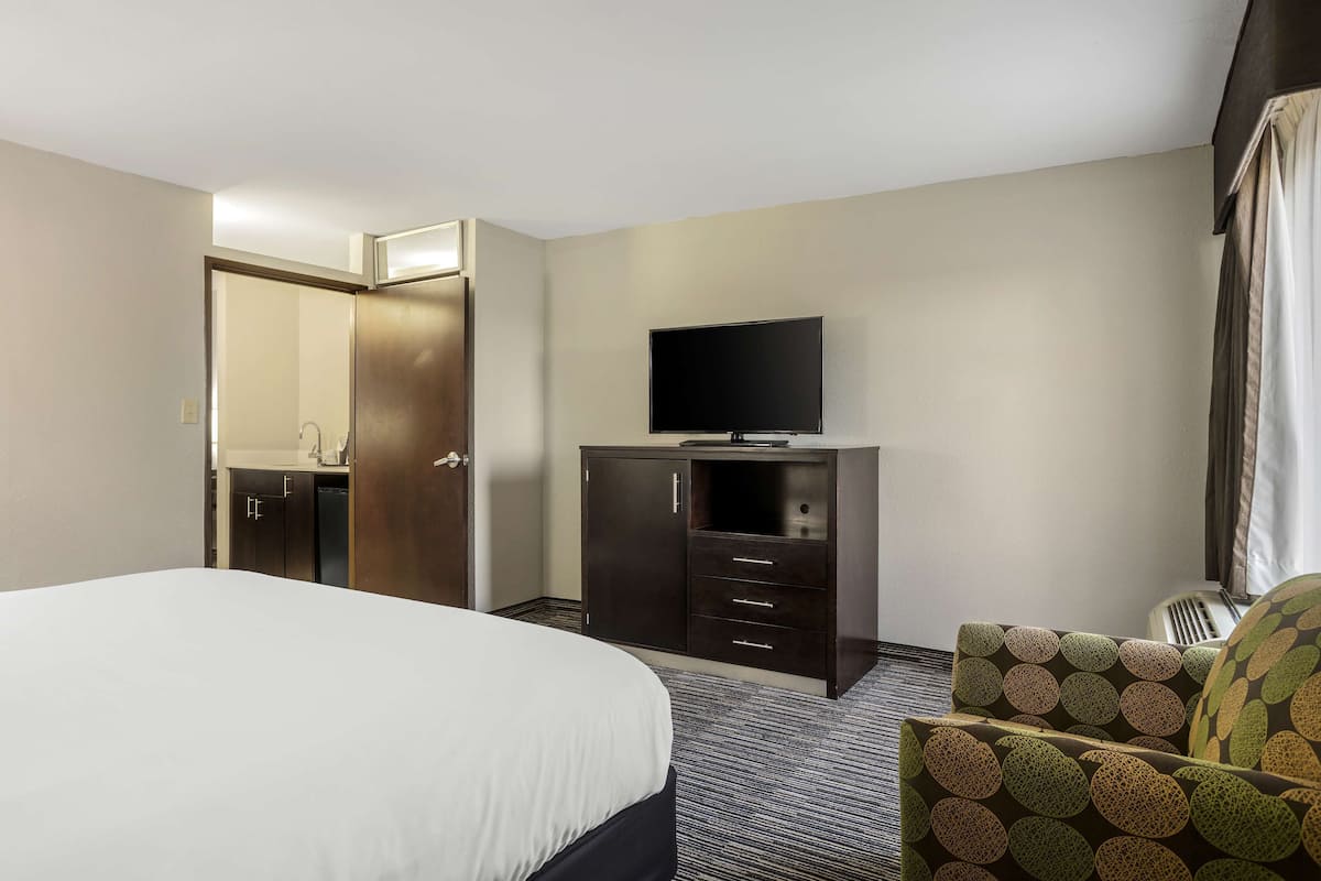 Premium bedding, desk, laptop workspace, iron/ironing board