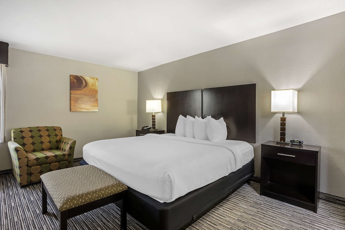 Premium bedding, desk, laptop workspace, iron/ironing board