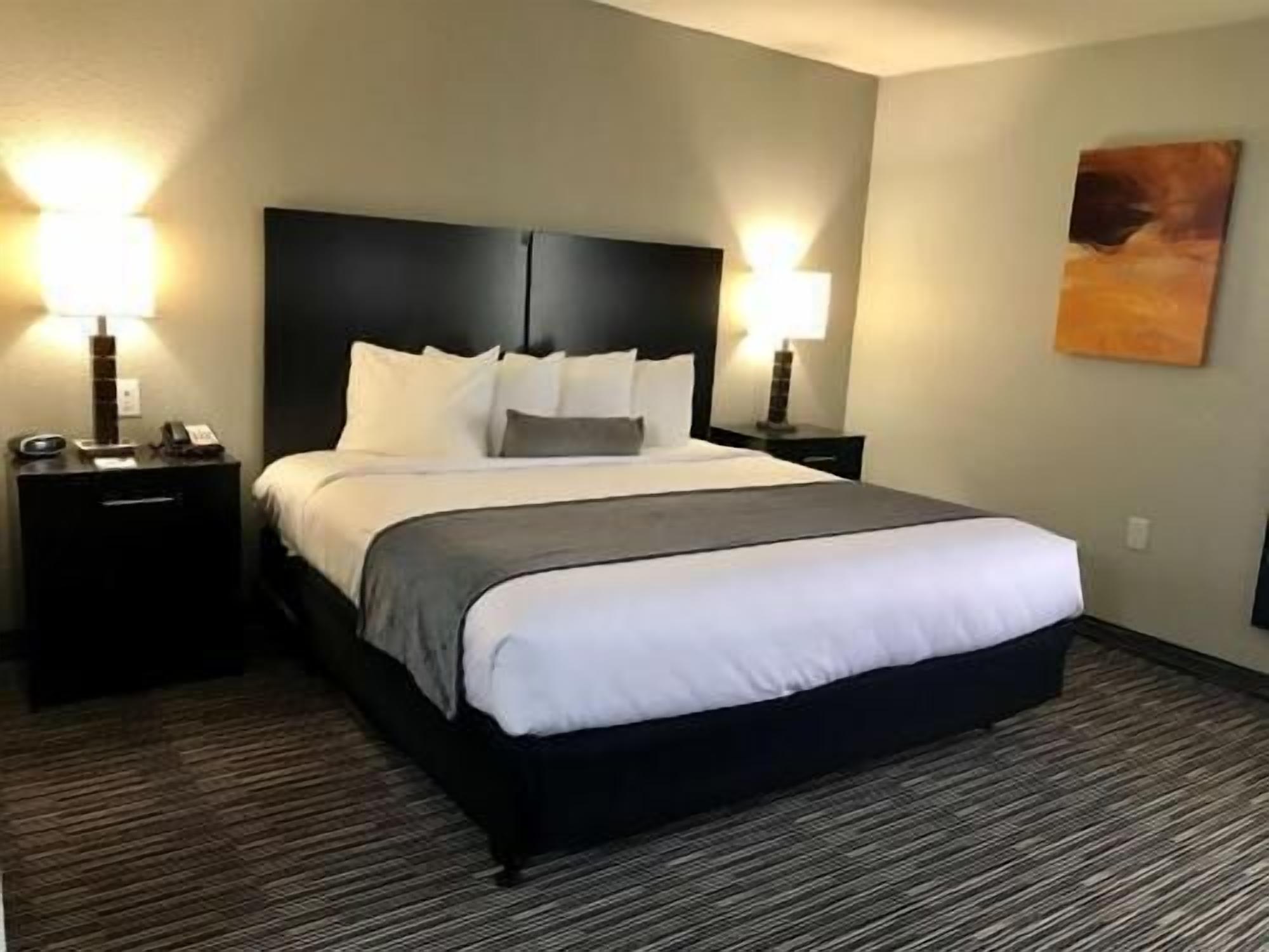 Premium bedding, desk, laptop workspace, iron/ironing board