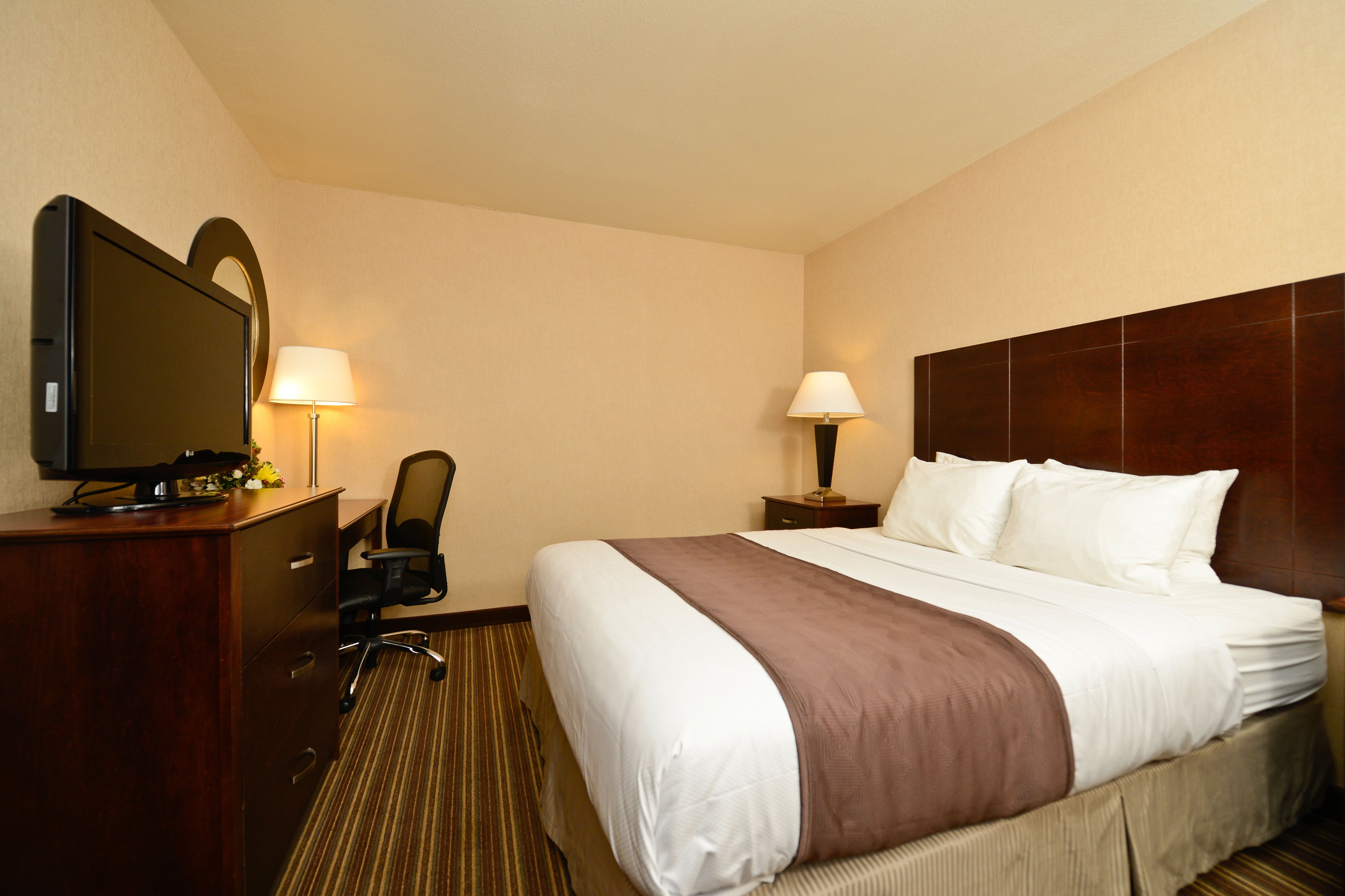 deluxe room, multiple beds (3 queens in a room) | in-room safe, desk, blackout curtains, iron/ironing board