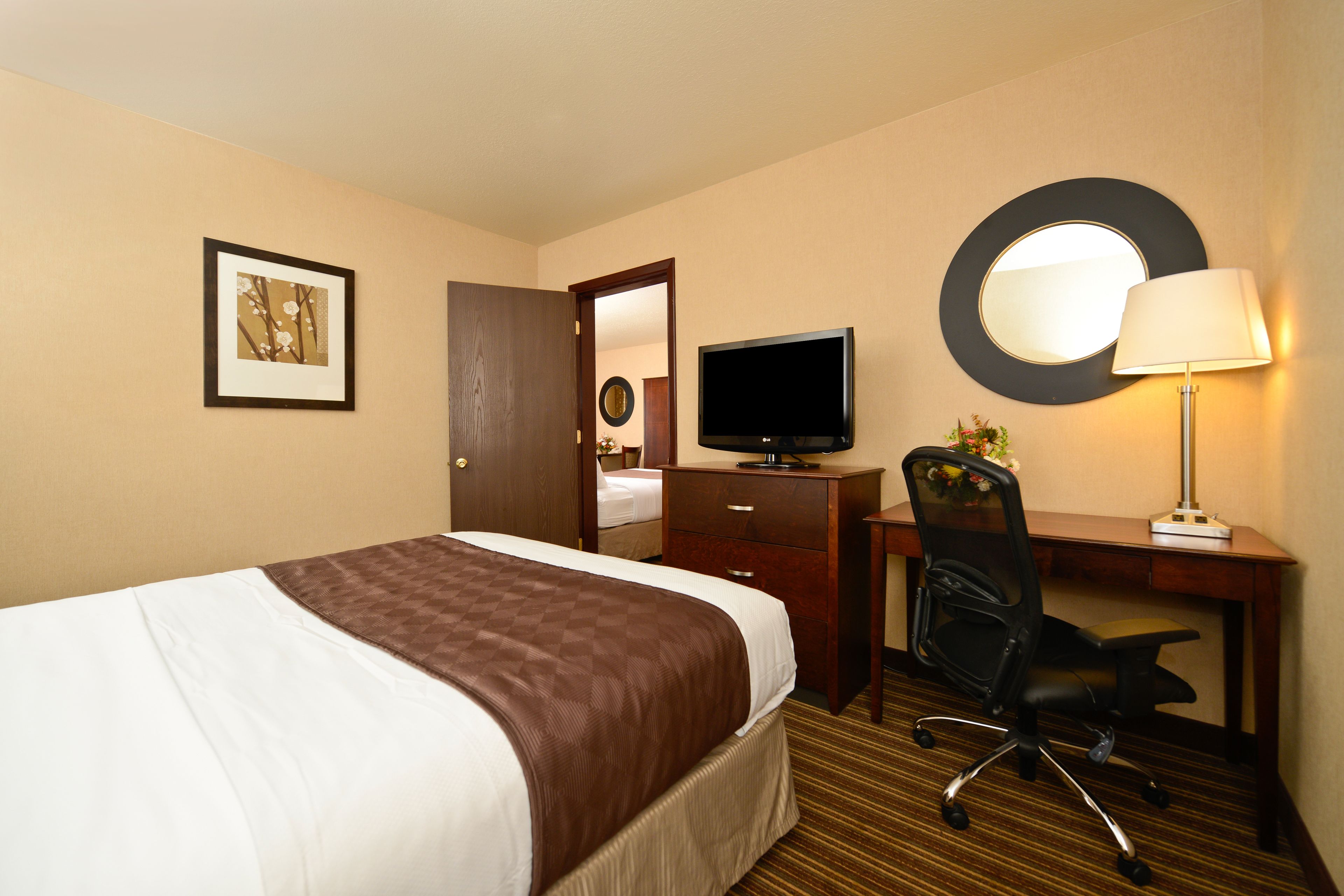 deluxe room, multiple beds (3 queens in a room) | in-room safe, desk, blackout curtains, iron/ironing board