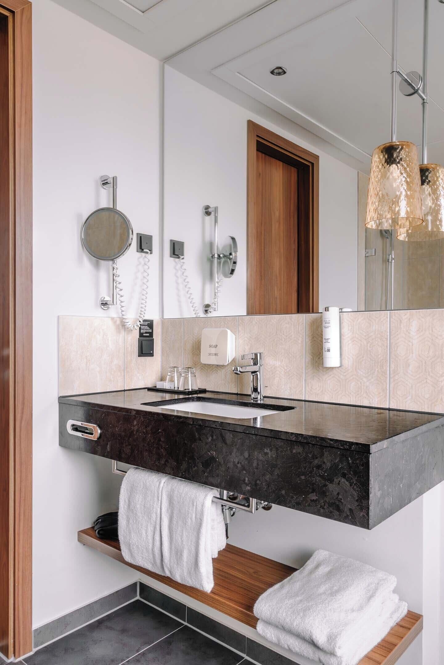 rainfall showerhead, hair dryer, towels, soap