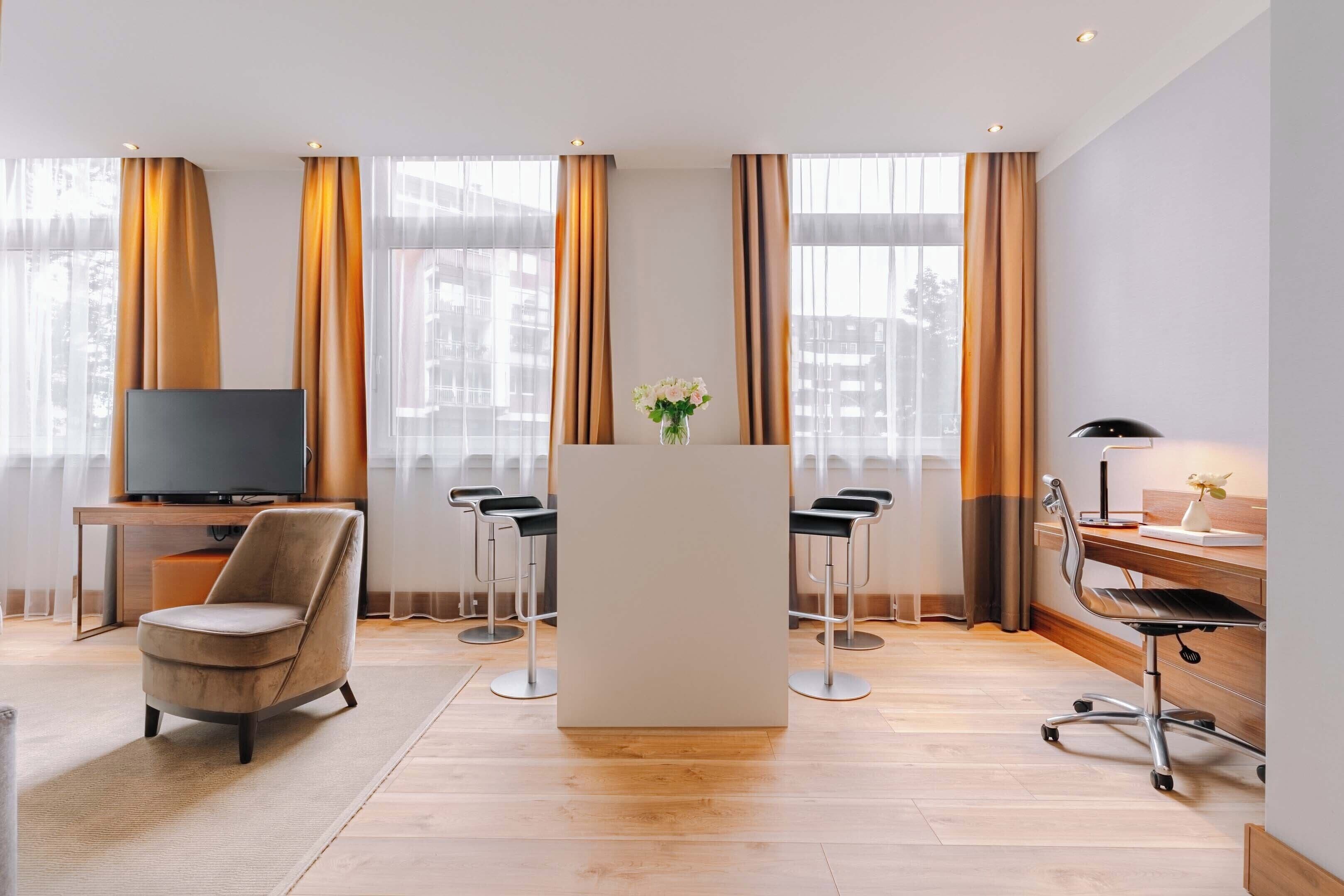 junior studio suite, 1 king bed | living area | flat-screen tv