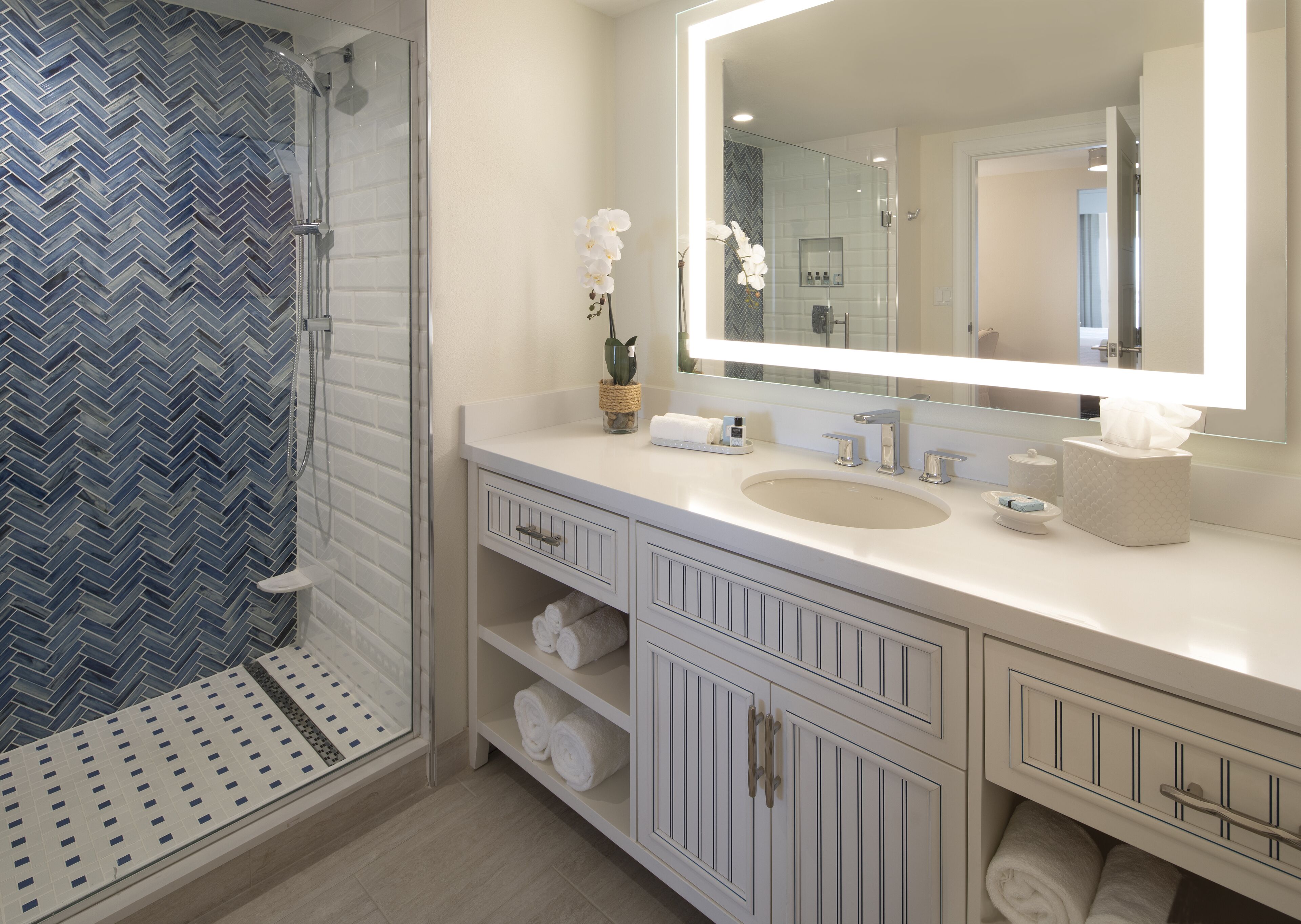 combined shower/bathtub, designer toiletries, hair dryer, bathrobes