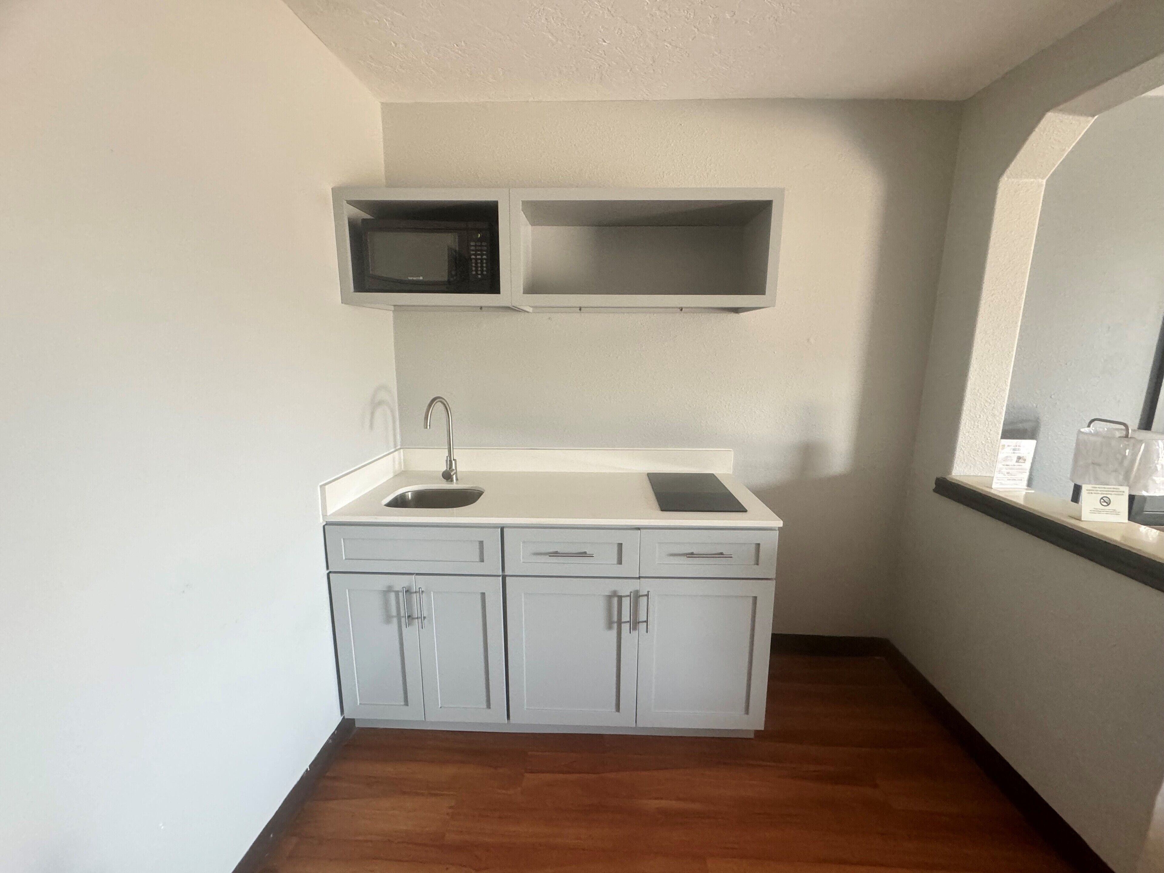 Efficiency, Room, 1 King Bed, Non Smoking, Ground Floor | Desk, laptop workspace, iron/ironing board, cribs (free)