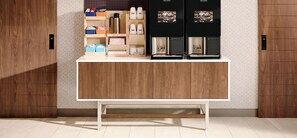 A modern kitchen with wooden cabinets, a white countertop, and two coffee machines. - Holiday Inn Express Moss Point by IHG (Moss Point)