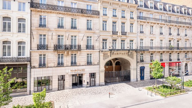 A multi-story hotel with a classic European architectural style, featuring arched doorways and balconies. - Marivaux Hotel (Brussels)