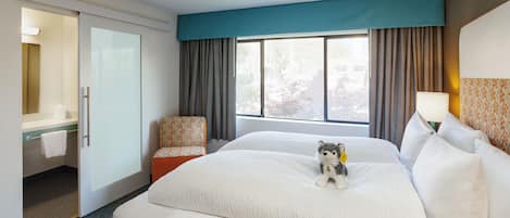 Premium bedding, down duvets, pillow-top beds, in-room safe