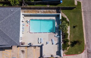 Outdoor pool, open 10:00 AM to 10:00 PM, pool loungers