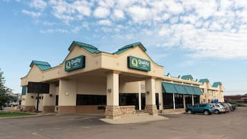 Guests can enter through one of several doors, accessing the parking lot and the hotel's interior.