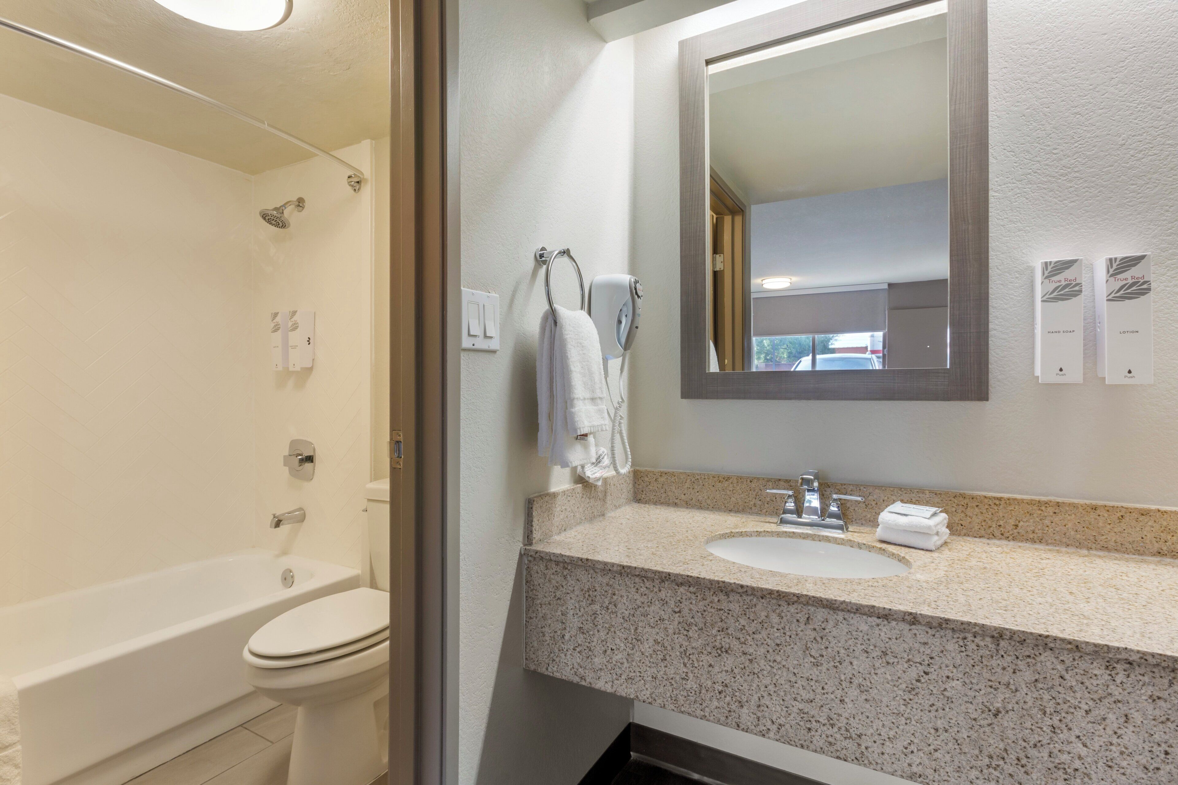 hair dryer, towels, soap, shampoo