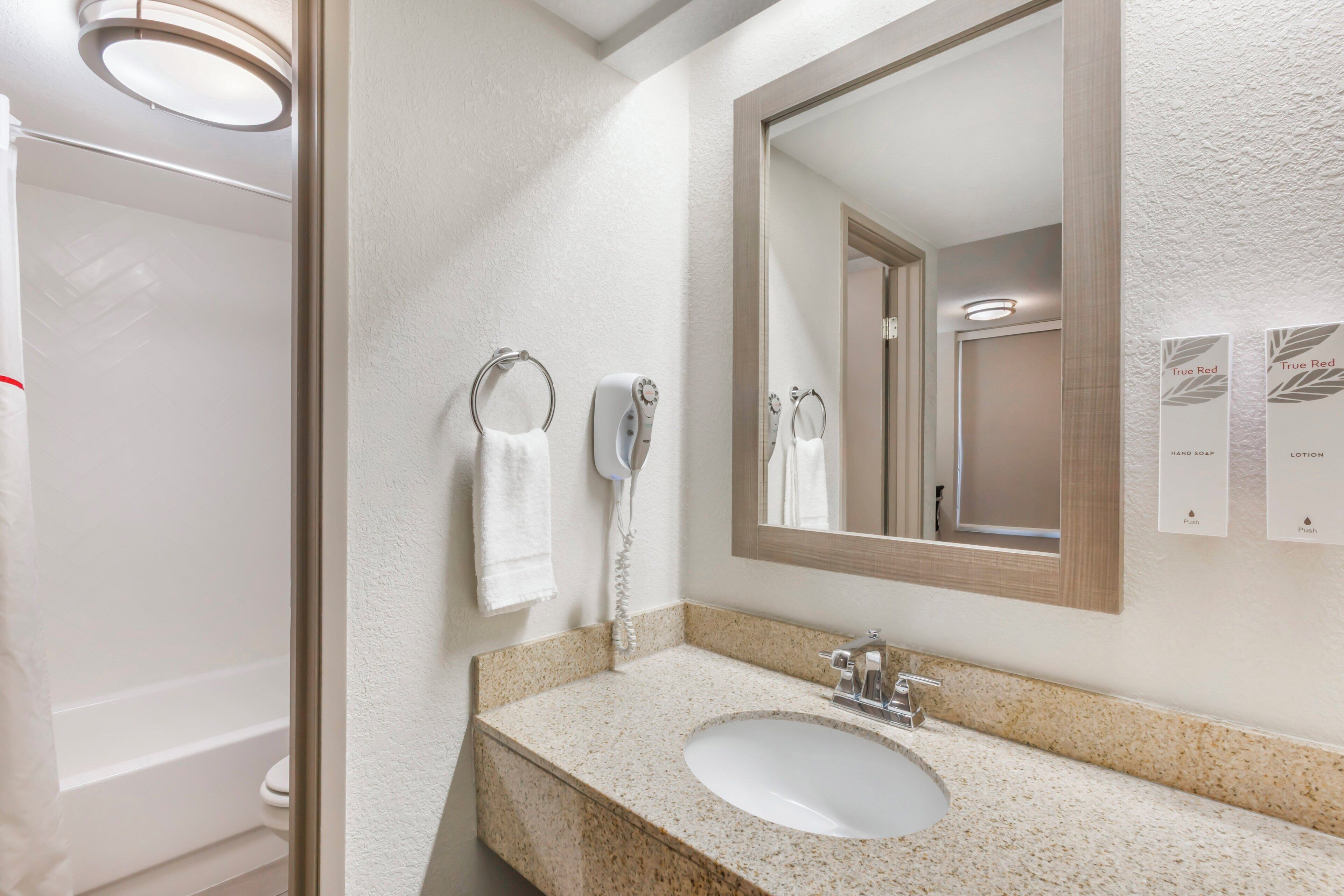 hair dryer, towels, soap, shampoo