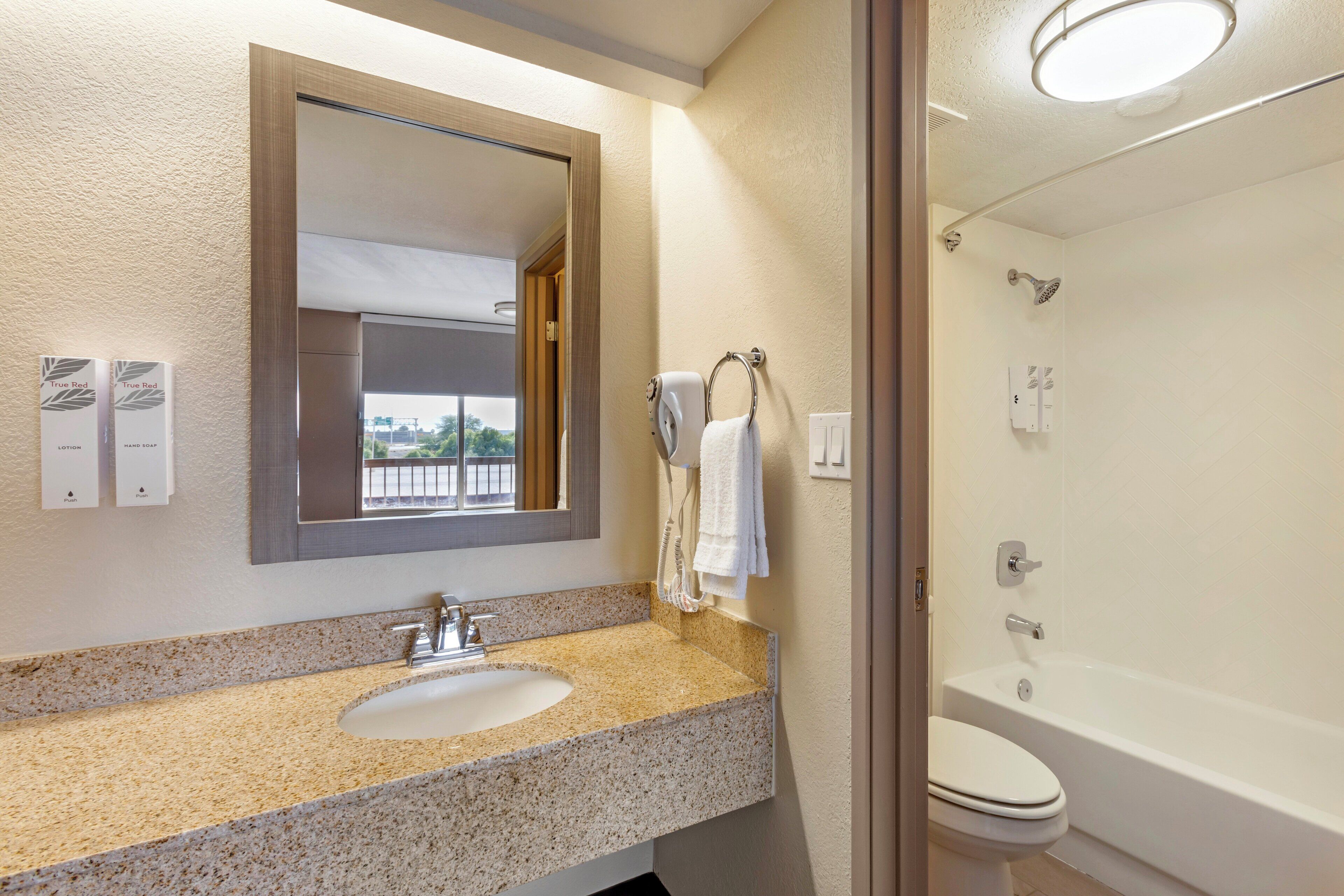 hair dryer, towels, soap, shampoo