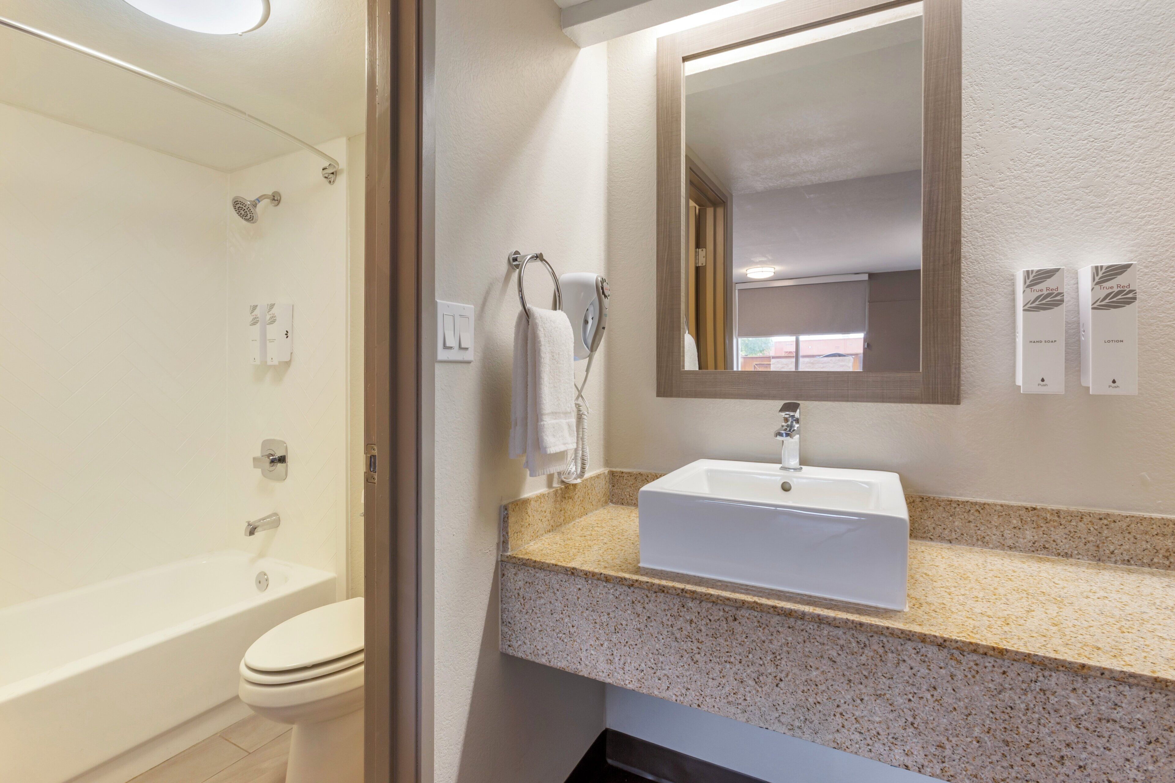 hair dryer, towels, soap, shampoo