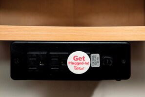 A black electronic device with a white sticker that reads "Get Plugged-In! RedRoof." - Red Roof Inn Tucson South - Airport (Tucson)