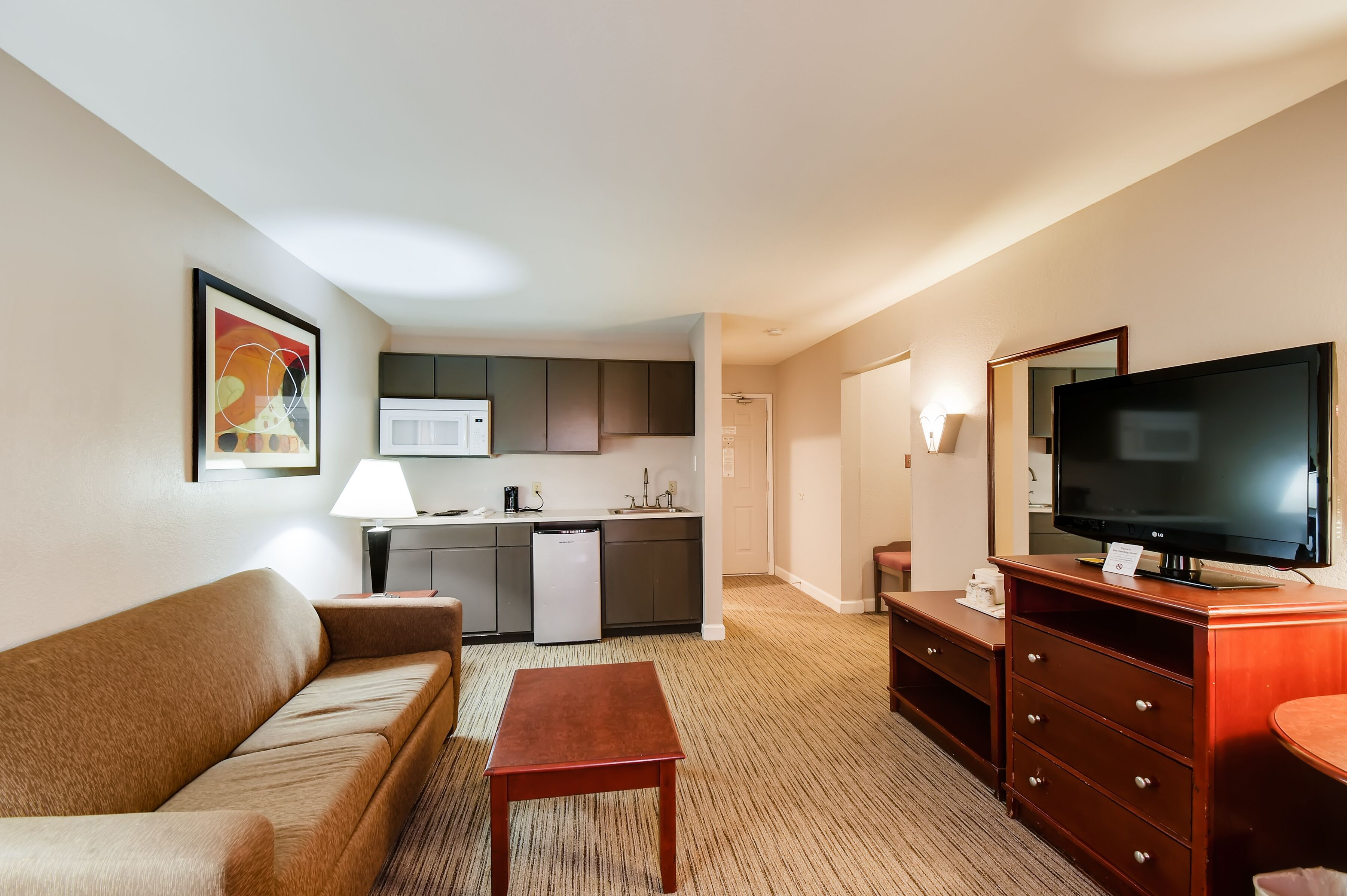 suite, 1 king bed | living area | tv