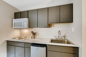 Suite, 1 King Bed | Private kitchen | Fridge, microwave, coffee/tea maker