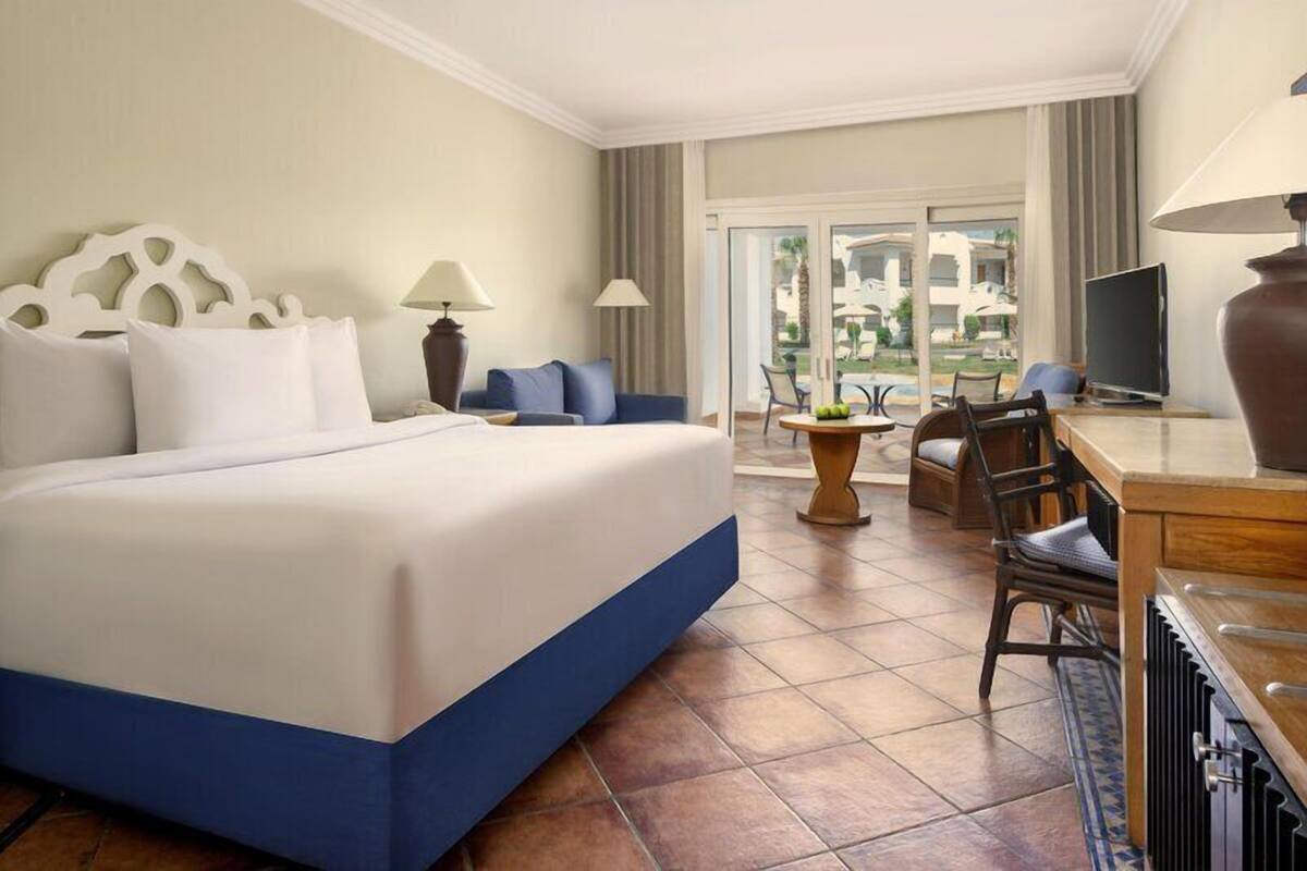 Superior Room, Pool View (Queen or Twin) | Minibar, in-room safe, desk, iron/ironing board