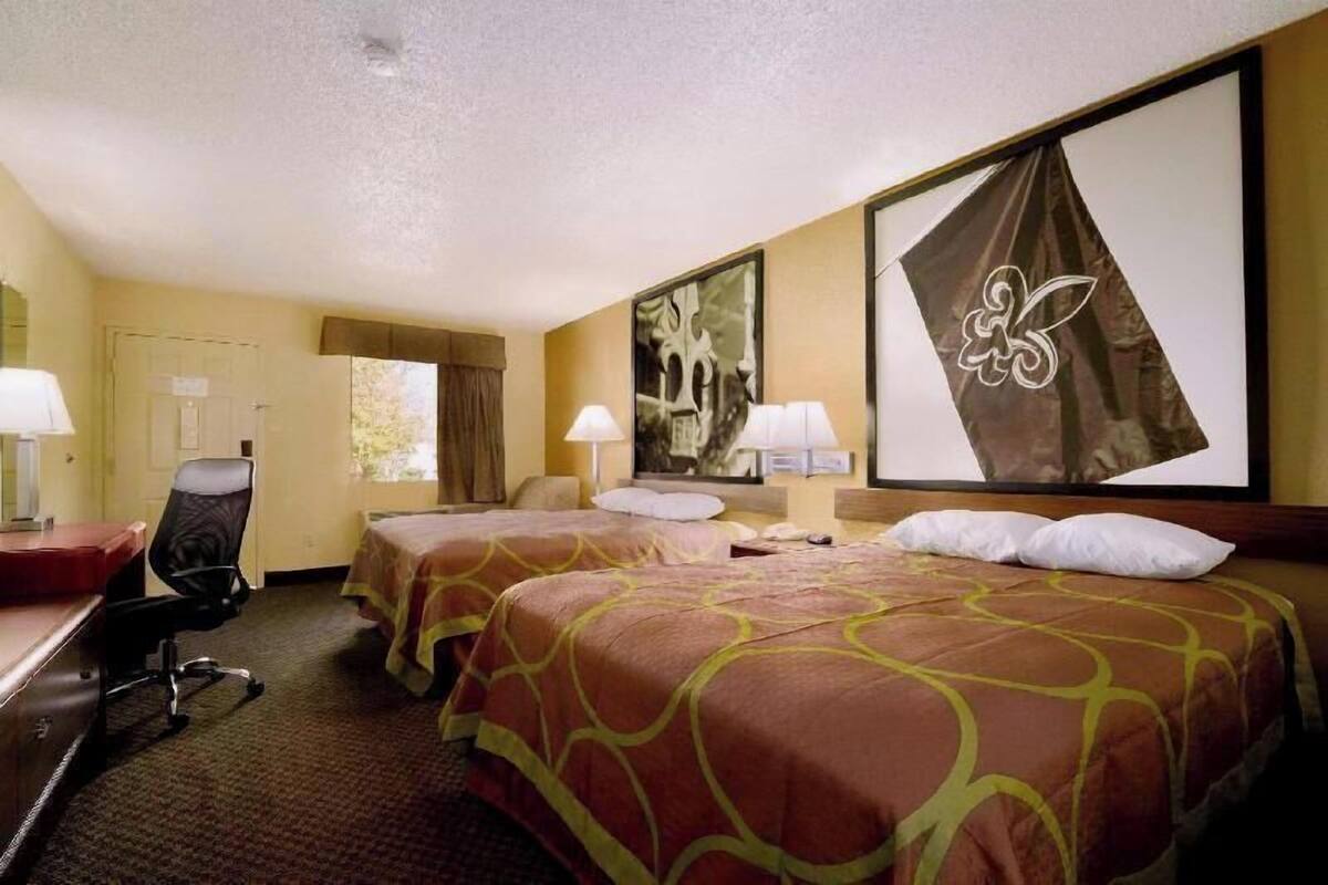 Desk, blackout curtains, free cots/infant beds, bed sheets