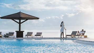 Outdoor pool, open 7:00 AM to 9:00 PM, sun loungers