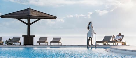 Outdoor pool, open 7:00 AM to 9:00 PM, sun loungers