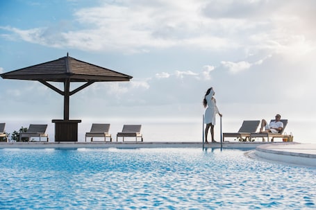 Outdoor pool, open 7:00 AM to 9:00 PM, pool loungers