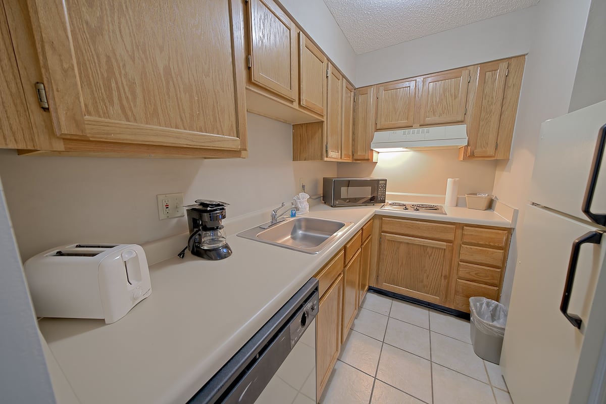 suite, 1 bedroom | private kitchen | full-sized fridge, microwave, stovetop, dishwasher