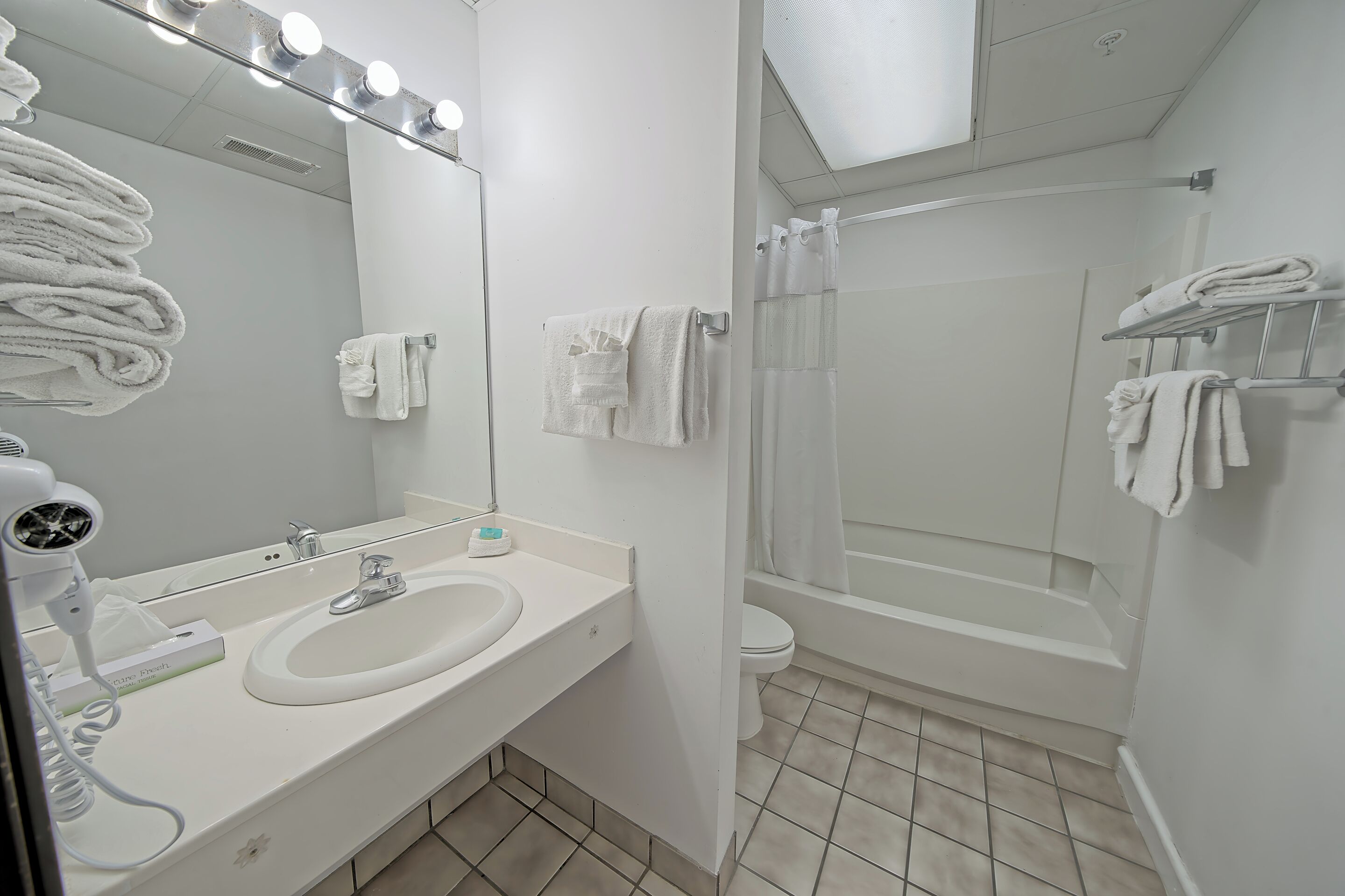 suite, 1 bedroom, jetted tub | bathroom | free toiletries, hair dryer, towels