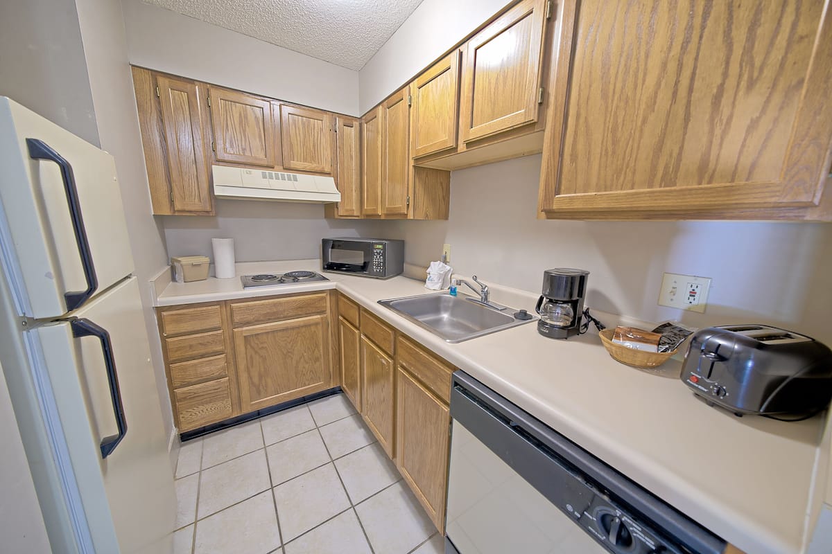 full-sized fridge, microwave, stovetop, dishwasher