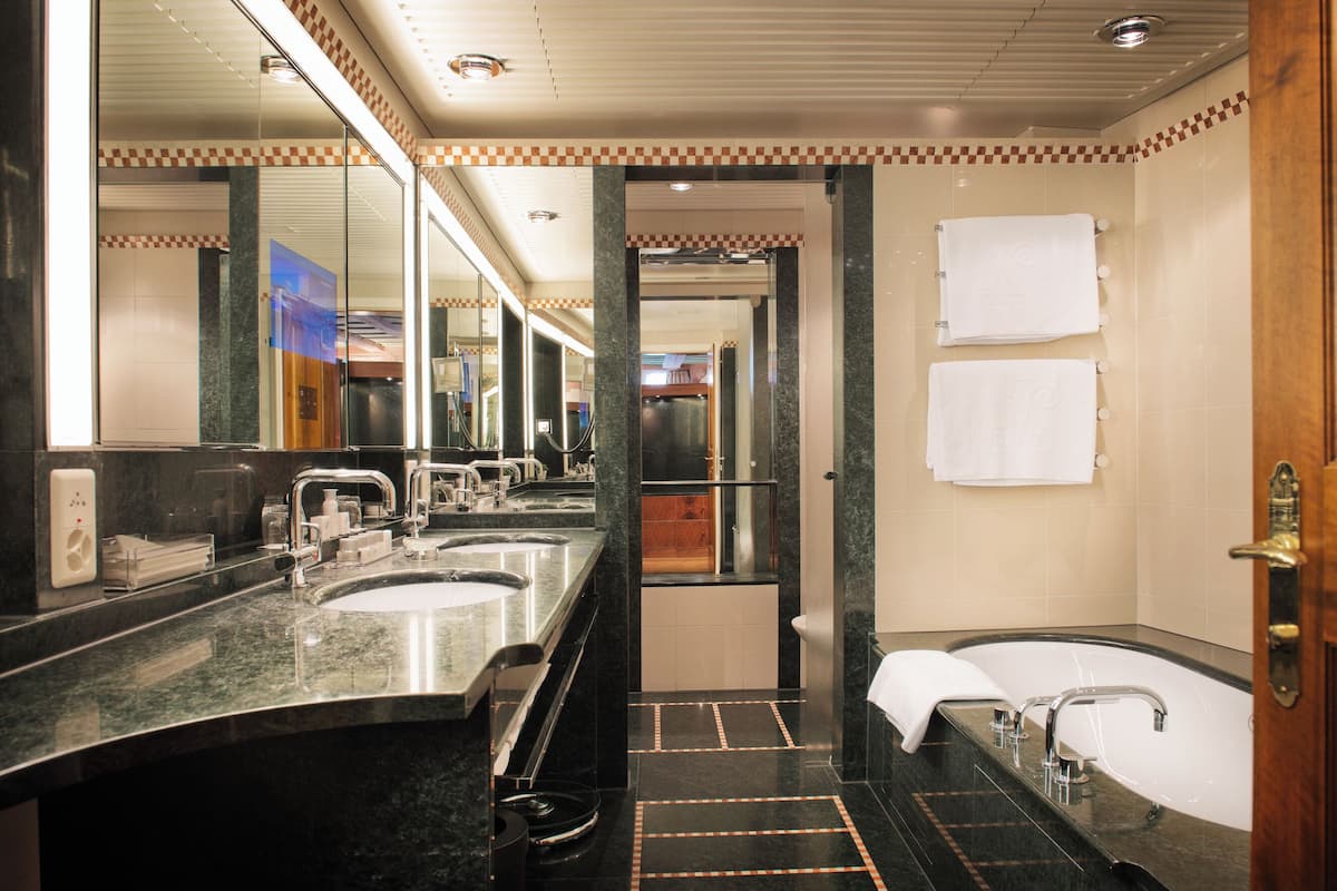 historic junior suite | bathroom | designer toiletries, hair dryer, bathrobes, slippers