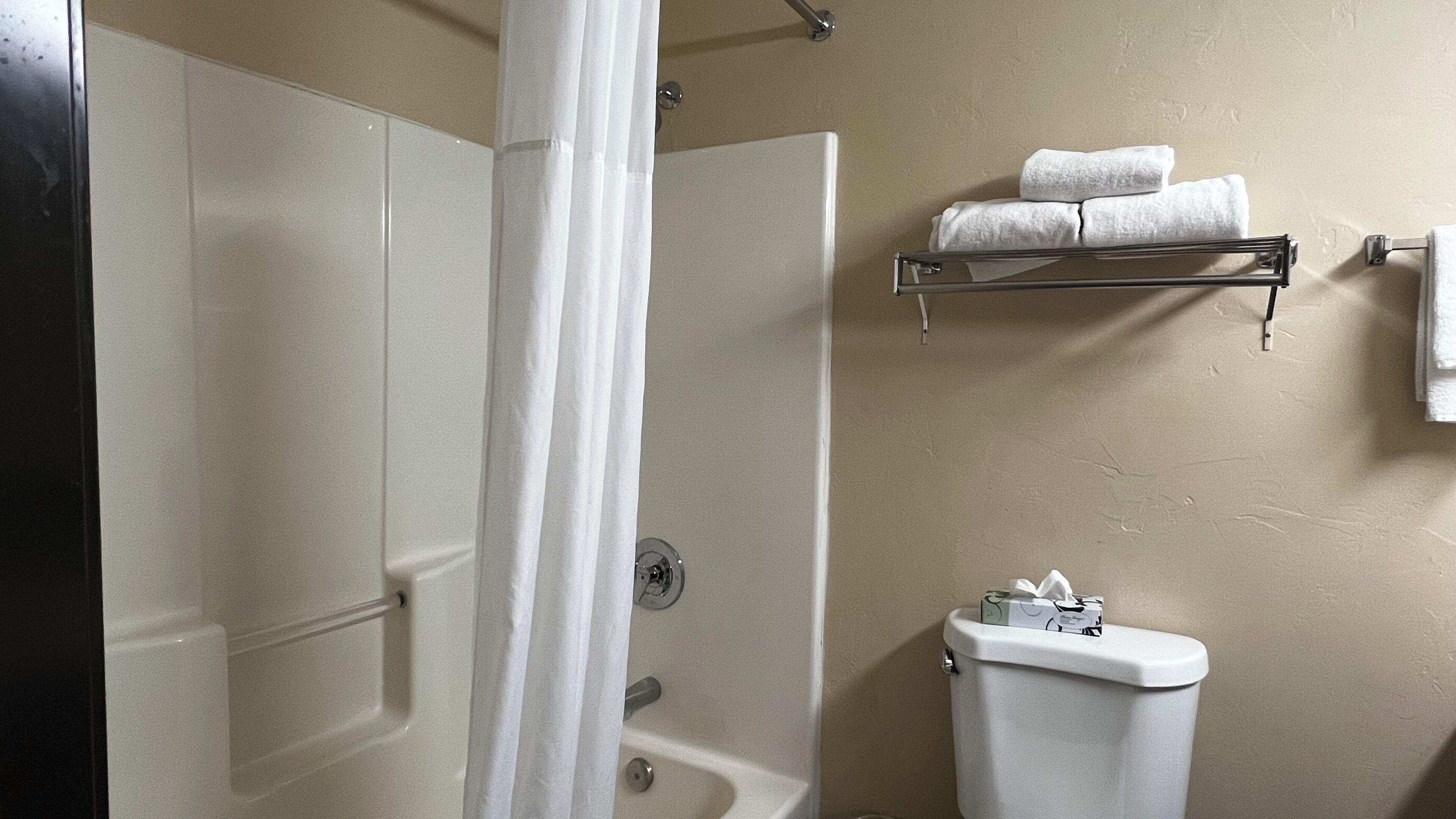 bathtub, hair dryer, towels